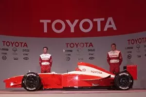Images Dated 22nd October 2001: Formula One Launch: Allan McNish talks with Mika Salo, stand with the Toyota F1 car