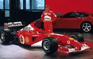 Images Dated 7th February 2002: Formula One Launch: The new Ferrari F2002 is unveiled by Michael Schumacher