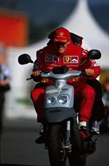 2001 Gallery: Formula One Testing: 2001 Formula One World Champion Michael Schumacher Ferrari takes his moped