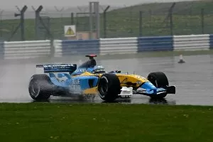 Images Dated 24th April 2003: Formula One Testing: Allan McNish Renault RS23 at a wet Silverstone