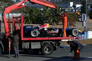 Images Dated 11th January 2006: Formula One Testing: The car of David Coulthard Red Bull Racing RB2 is picked up by a truck