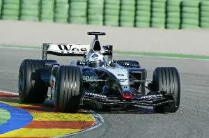 Images Dated 25th November 2003: Formula One Testing: David Coulthard makes the first run of the McLaren MP4-19