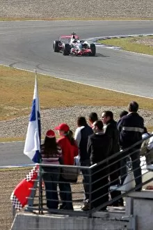 Images Dated 6th December 2007: Formula One Testing: Fans watch Pedro De La Rosa McLaren Mercedes MP4 / 22