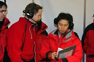 Images Dated 21st February 2006: Formula One Testing: Gerry Hughes Super Aguri F1 race engineer talks with a Bridgestone engineer
