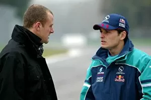 Images Dated 20th February 2004: Formula One Testing: Gianmaria Bruni Minardi chats with Giancarlo Fisichella Sauber