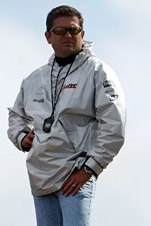 Images Dated 14th July 2004: Formula One Testing: Gil de Ferran watches the action in a McLaren jacket