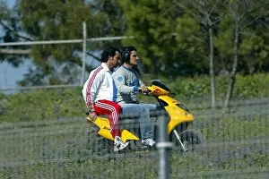 Images Dated 11th February 2004: Formula One Testing: Giorgio Pantano, testing for Jordan, takes a trip on a moped