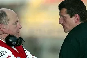 Images Dated 22nd March 2002: Formula One Testing: Guenther Steiner, right, Jaguar Technical Director chats with a Toyota engineer
