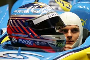 Images Dated 29th November 2006: Formula One Testing: Heikki Kovalainen Renault talks with a representative of Bell helmets