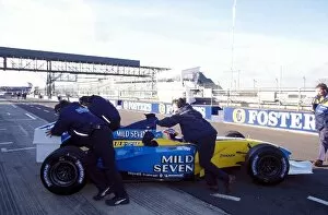 Images Dated 20th February 2003: Formula One Testing: Jarno Trulli Renault R202 is pulled back into the pit garage