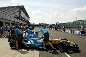 Images Dated 2nd June 2004: Formula One Testing: Jarno Trulli Renault R24 is pushed into the pits in front of the Renault guests