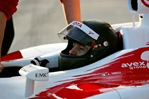 Images Dated 7th December 2004: Formula One Testing: Jarno Trulli Toyota tries out a new carbon fibre helmet