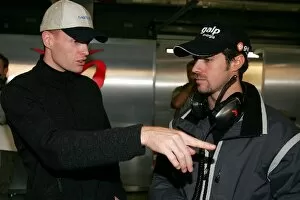 Images Dated 7th December 2005: Formula One Testing: Jeffrey van Hooydonk talks with Tiago Monteiro MF1 Racing