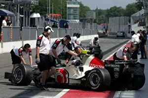 Formula One Testing: Jenson Button Honda RA106 is pushed back into the garage