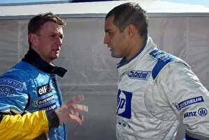 Images Dated 12th February 2003: Formula One Testing: L to R: Allan McNish Renault test driver chats with Juan Pablo Montoya