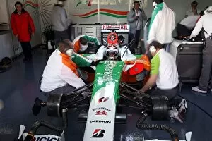 Formula One Testing: Mechanics work on the car of Adrian Sutil Force India F1 VJM02