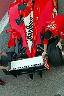 Images Dated 22nd March 2002: Formula One Testing: Michael Schumacher Ferrari F2002 is pushed back into his garage