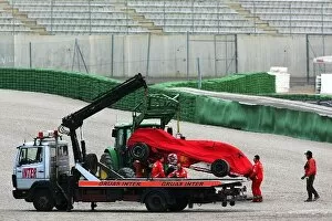 Images Dated 22nd February 2005: Formula One Testing: Michael Schumachers Ferrari F2004M is lifted onto the back of the recovery