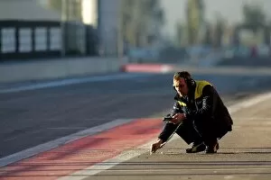 Images Dated 19th January 2005: Formula One Testing: A Michelin technician checks the track tempature