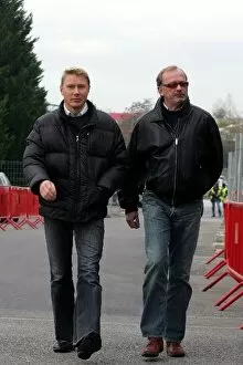 Images Dated 29th November 2006: Formula One Testing: Mika Hakkinen arrives in the paddock with his Manager Didier Coton