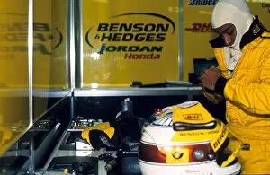 Images Dated 18th September 2001: Formula One Testing: Narain Karthikeyan prepares himself for his first test with the Jordan team