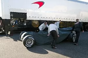 Images Dated 21st May 2003: Formula One Testing: The new McLaren MP4 / 18 is unloaded from a truck prior to its debut test