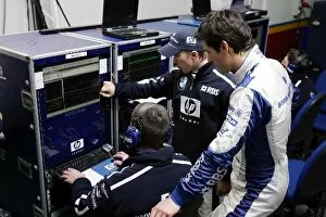 Images Dated 31st January 2005: Formula One Testing: Nick Heidfeld Williams and team mate Mark Webber Williams study telemetry