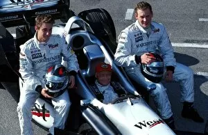 Images Dated 20th December 2001: Formula One Testing: Niki Lauda takes the controls of the McLaren 2 seater to give his sons Matius