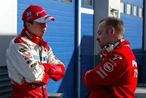 Images Dated 11th December 2003: Formula One Testing: Olivier Panis Toyota talks with Mike Gascoyne