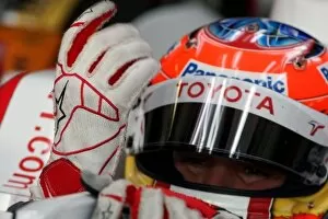 Images Dated 24th July 2008: Formula One Testing: Timo Glock Toyota puts his Alpinestars gloves