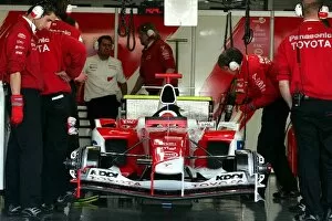 Images Dated 13th January 2005: Formula One Testing: Toyota engineers in the garage with the Toyota TF105