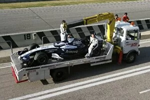 Transporter Collection: Formula One Testing: The Williams FW29 of Kazuki Nakajima being recoverd to the garage