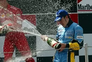Images Dated 4th May 2003: Formula One World Championship: 2nd place finisher Fernando Alonso Renault on the podium