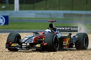 Images Dated 19th August 2002: Formula One World Championship: Anthony Davidson Minardi Asiatech PS02 takes to the gravel during
