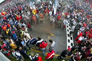 Images Dated 9th March 2003: Formula One World Championship: Aussie race fans celebrates a great opener to the season