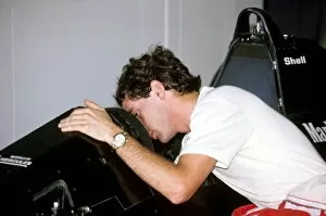 F1 Collection: Formula One World Championship: Ayrton Senna peers into the cockpit of his McLaren MP4 / 5