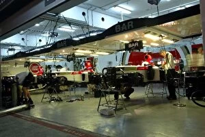Images Dated 3rd April 2004: Formula One World Championship: BAR mechanics work on the cars in the garage into the night