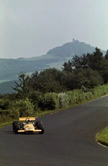 1969 Collection: Formula One World Championship: Bruce McLaren McLaren M7C, who finished third, enters Wippermann