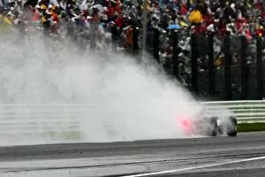 Images Dated 8th October 2005: Formula One World Championship: A car kicks up the spray in the rain