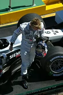 Images Dated 8th March 2003: Formula One World Championship: The car of Kimi Raikkonen McLaren is returned to the pits after