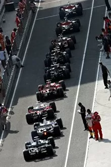 Formula One World Championship: Cars line up at the end of the pitlane