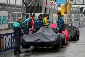 Images Dated 7th July 2005: Formula One World Championship: Cars in the pitlane covered to protect them from the rain