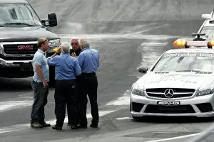 Images Dated 8th June 2008: Formula One World Championship: Charlie Whiting FIA Delegate takes a look at more repair work to