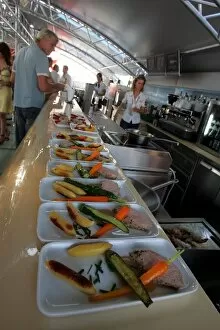 Images Dated 29th July 2005: Formula One World Championship: A chef prepares food in the Red Bull Energy Station
