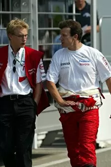 Images Dated 31st July 2003: Formula One World Championship: Chris Hughes Toyota Communications Co-Ordinator with Olivier Panis