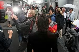 Formula One World Championship: Clive Mason Getty Images shoots Takuya Kimura over his shoulder