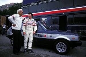 1980 Collection: Formula One World Championship: Colin Chapman Team owner Lotus talks with Mario Andretti Lotus