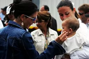 Images Dated 25th September 2005: Formula One World Championship: Connie Montoya admires Sophia Pizzonia the baby of Antonio
