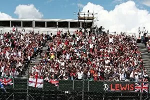 Images Dated 7th July 2007: Formula One World Championship: The crowd celebrate pole position for Lewis Hamilton McLaren