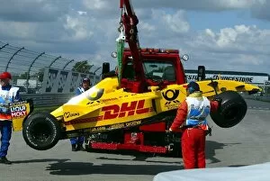 Images Dated 27th September 2002: Formula One World Championship: The damaged Jordan EJ12 of Takuma Sato is rescued from the track